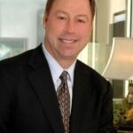 Charles D Brecker