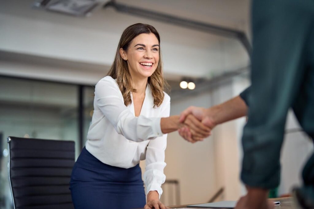 HOA attorney Florida - attorney shaking hands with a client at a law firm