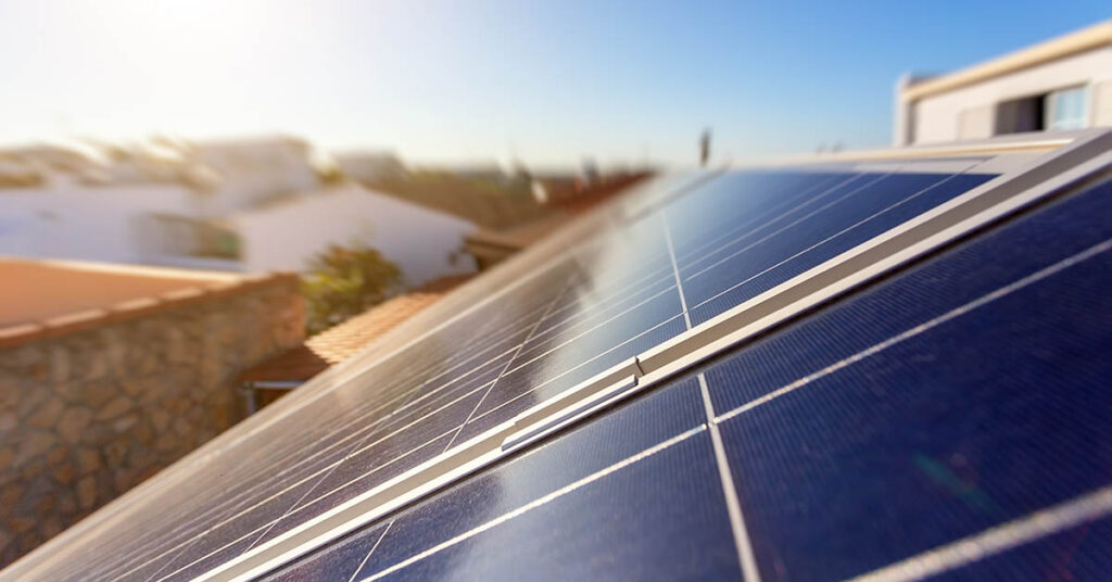 Solar panels installed on a residential house roof, illustrating HOA solar panel rights in Florida and Texas