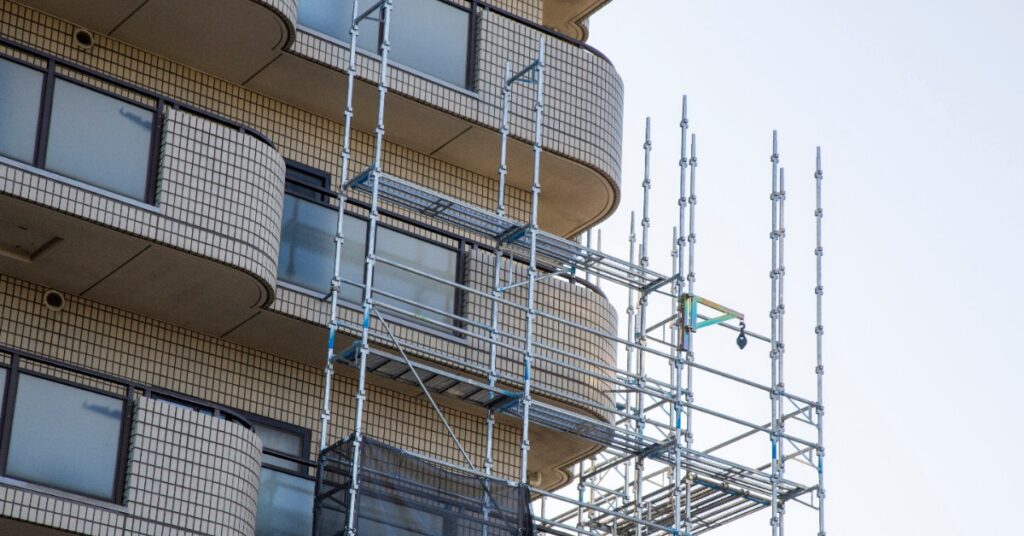Condominium building wrapped in scaffolding during a major repair, the kind of project that triggers an HOA special assessment